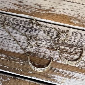 Gold hanging studs with a moon and star